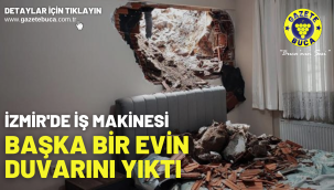 İzmir'de iş makinesi başka bir evin duvarını yıktı
